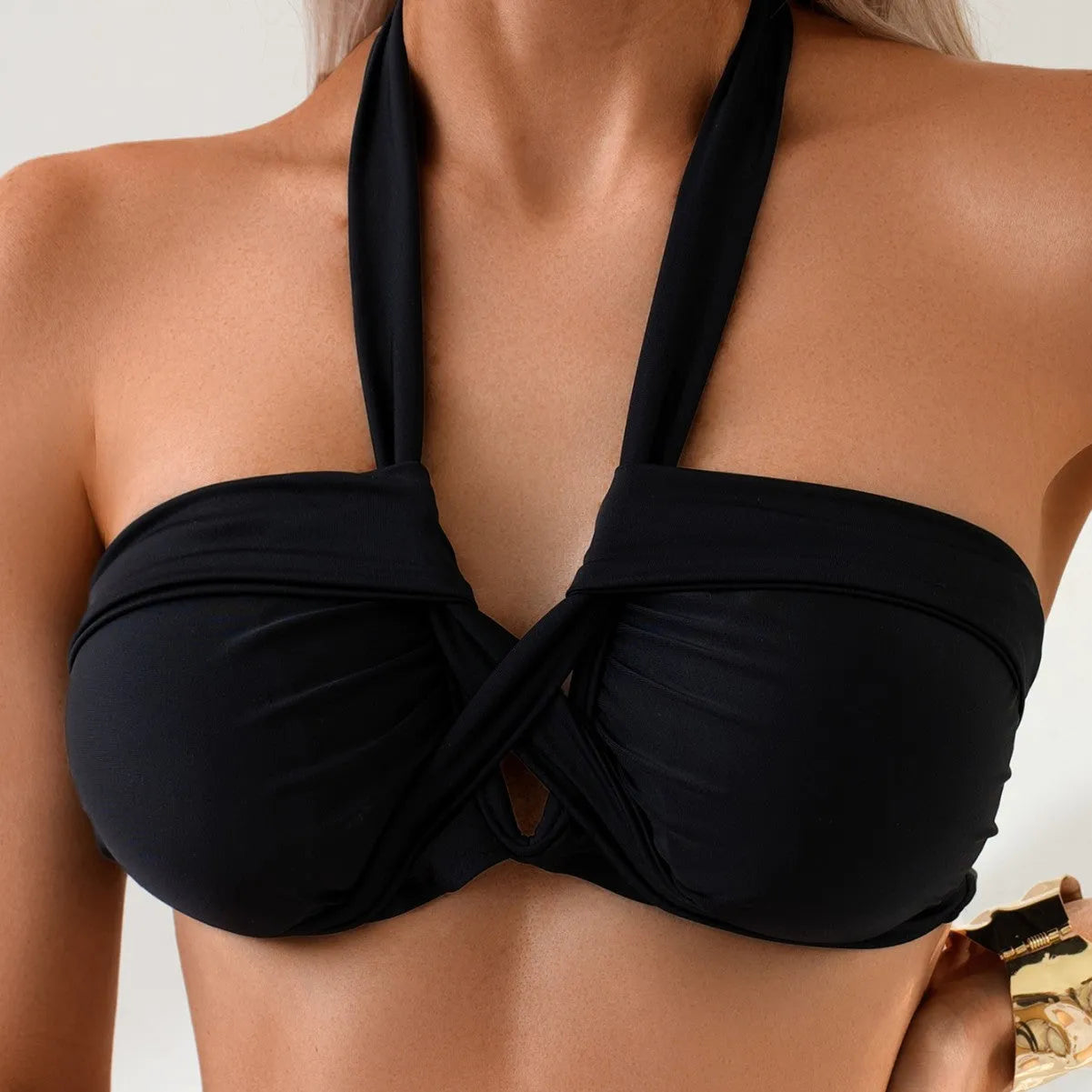 Black backless one-piece women's swimming costume on a mannequin