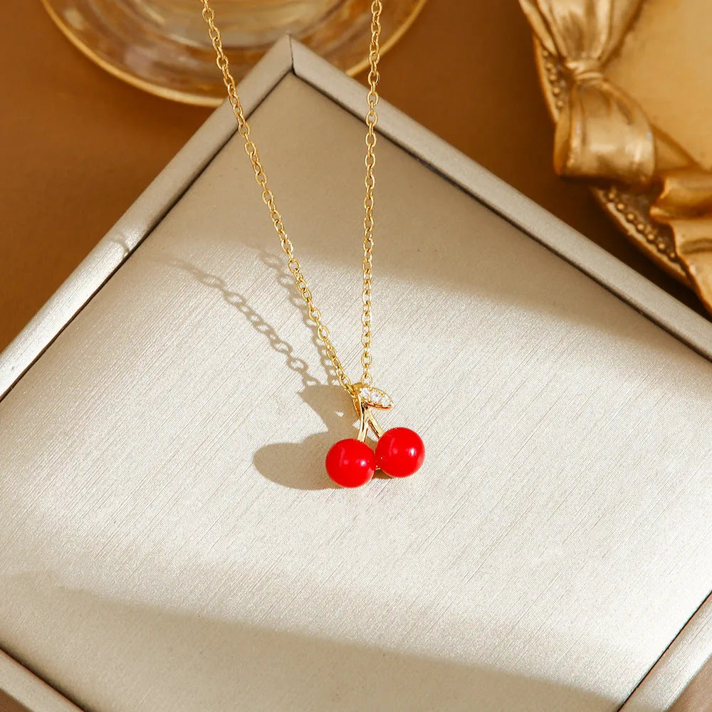 Women's titanium steel necklace with delicate indie pendant designs including strawberry, cherry, and pepper motifs