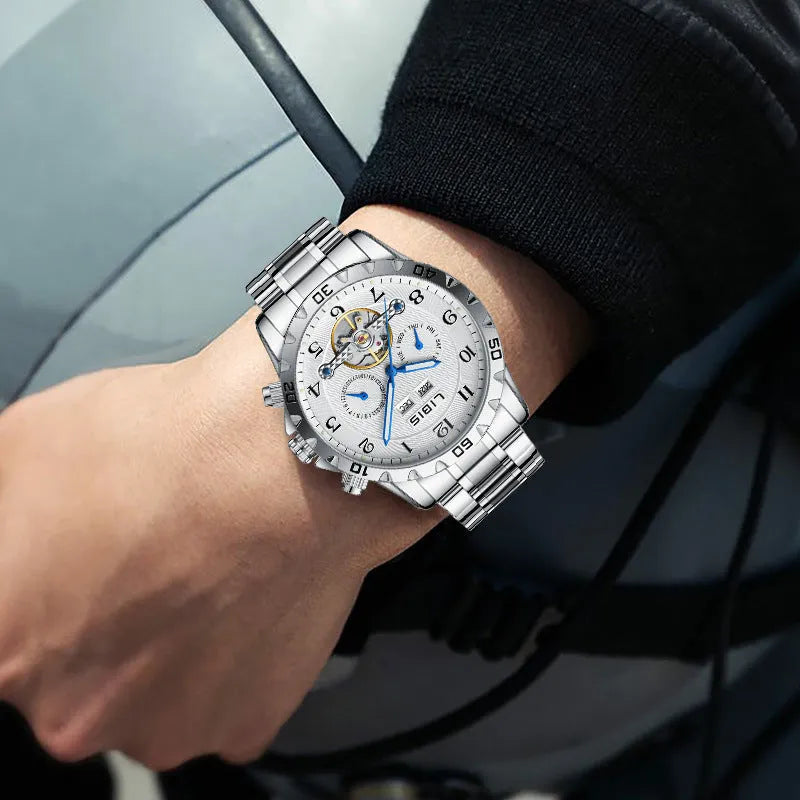 Silver men's automatic perpetual calendar watch with stainless steel band and sapphire glass.