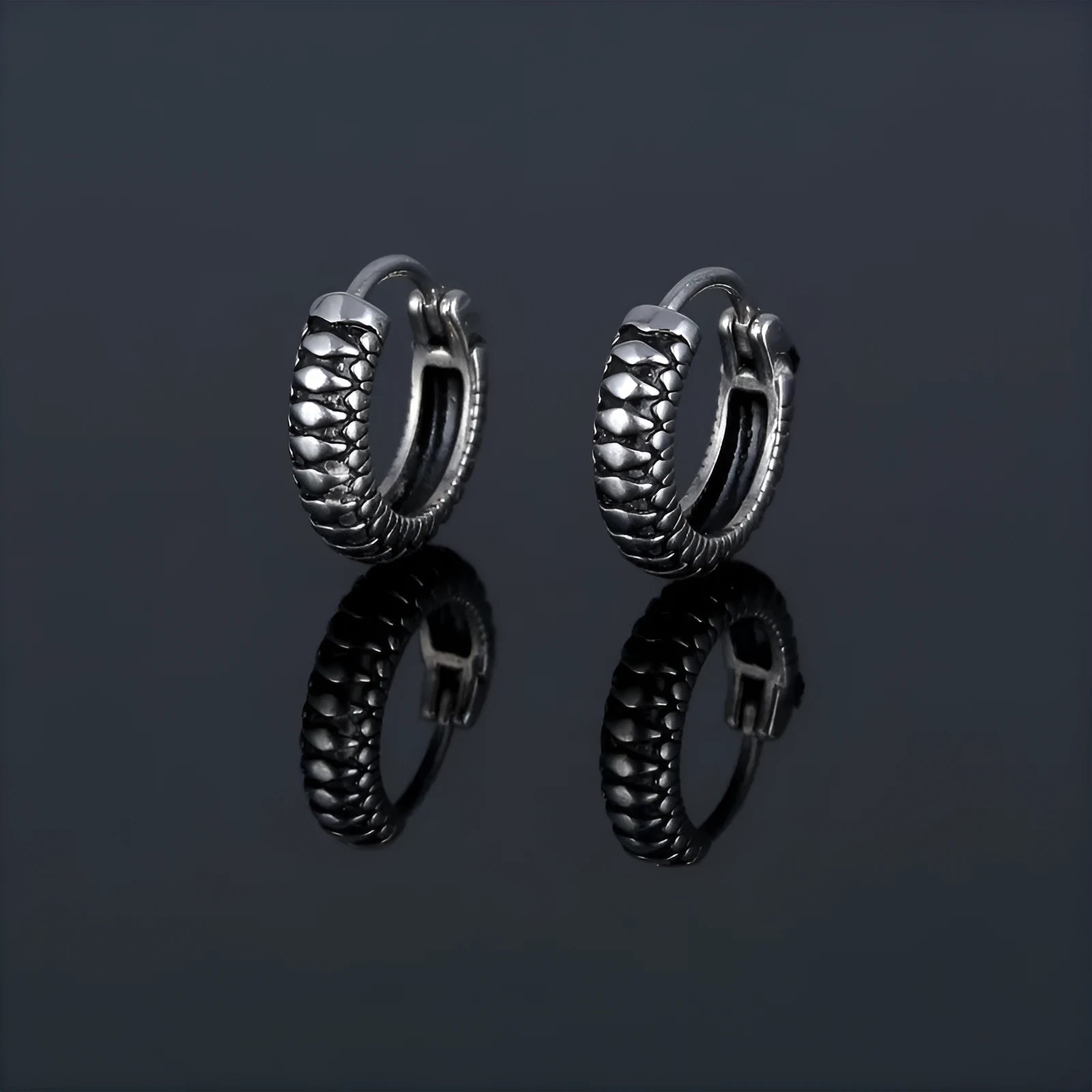 Silver geometric retro twist earrings with stripes made from titanium steel on a white background.