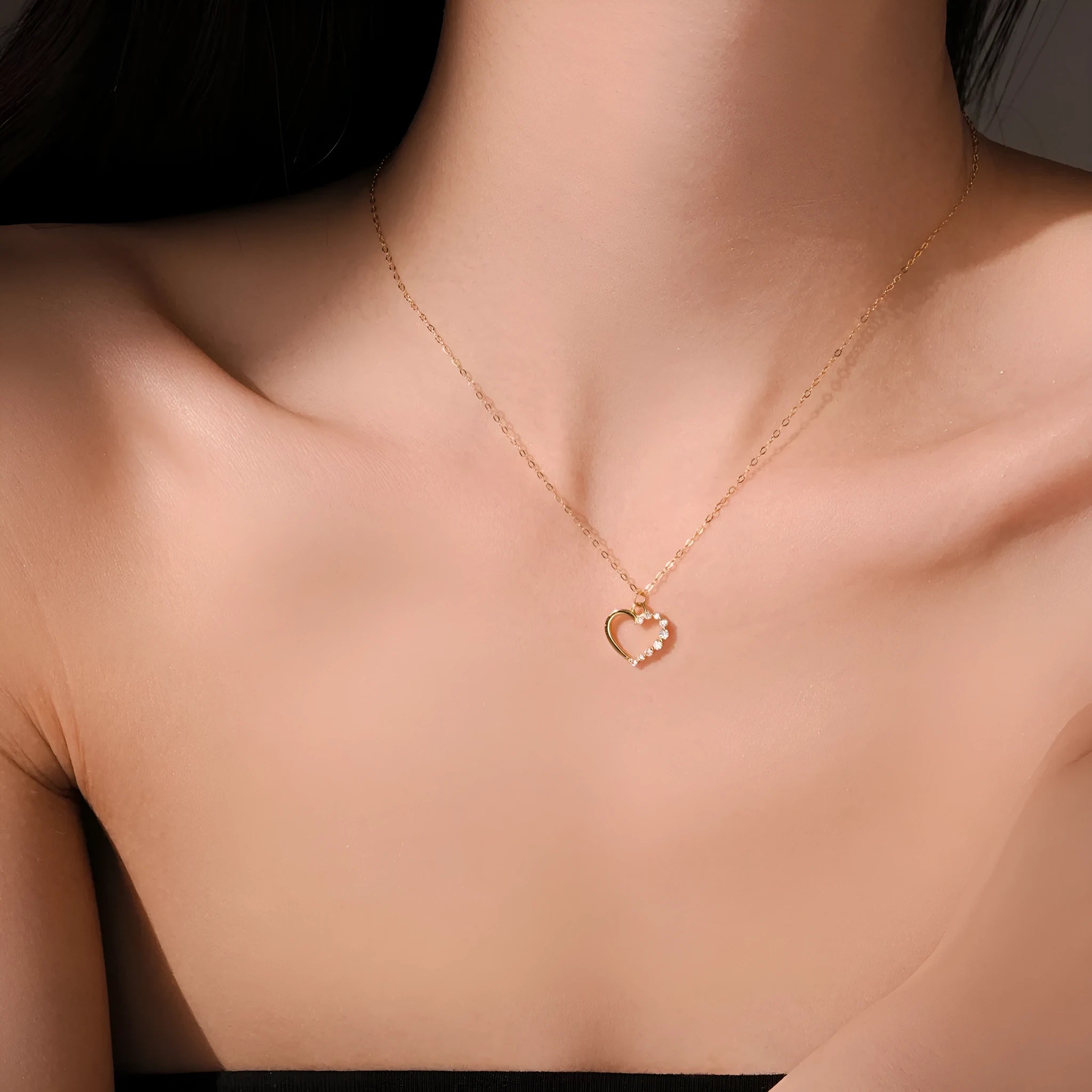 Sterling silver hollow heart necklace with circular details on a regular chain
