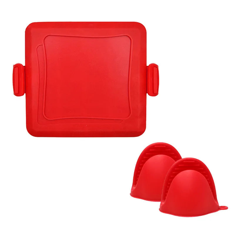 Red silicone baking tray with matching heat-resistant gloves on kitchen counter