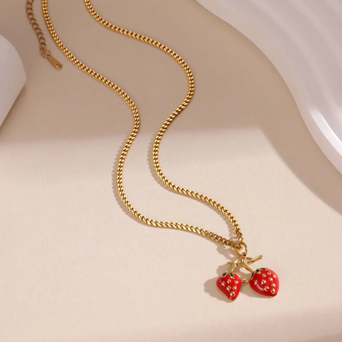 Stainless steel strawberry fruit pendant necklace with white powder gradient finish and red charm
