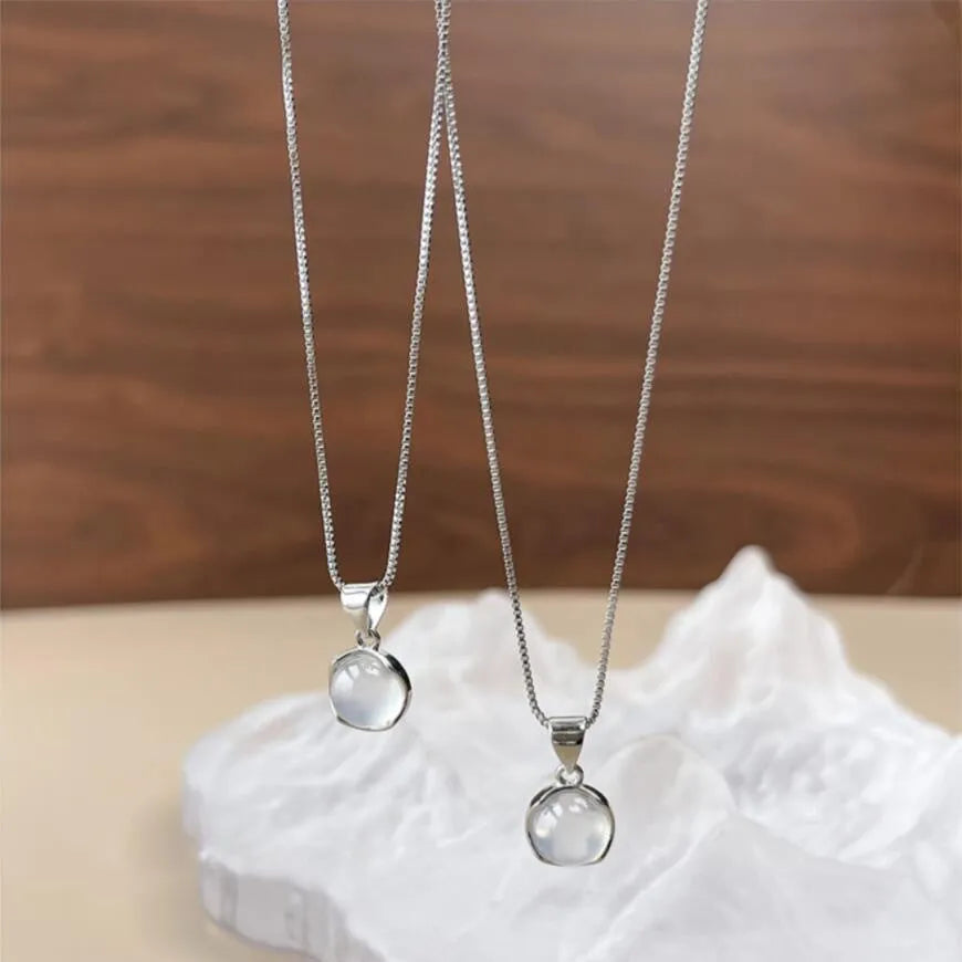Women's geometric eight-pointed star pendant necklace on an adjustable box chain, moon light colour.