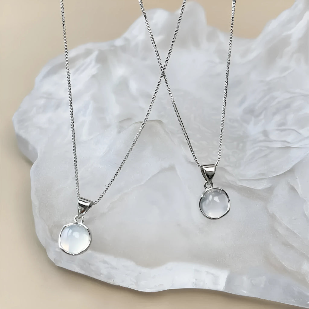 Women's geometric eight-pointed star pendant necklace on an adjustable box chain, moon light colour.
