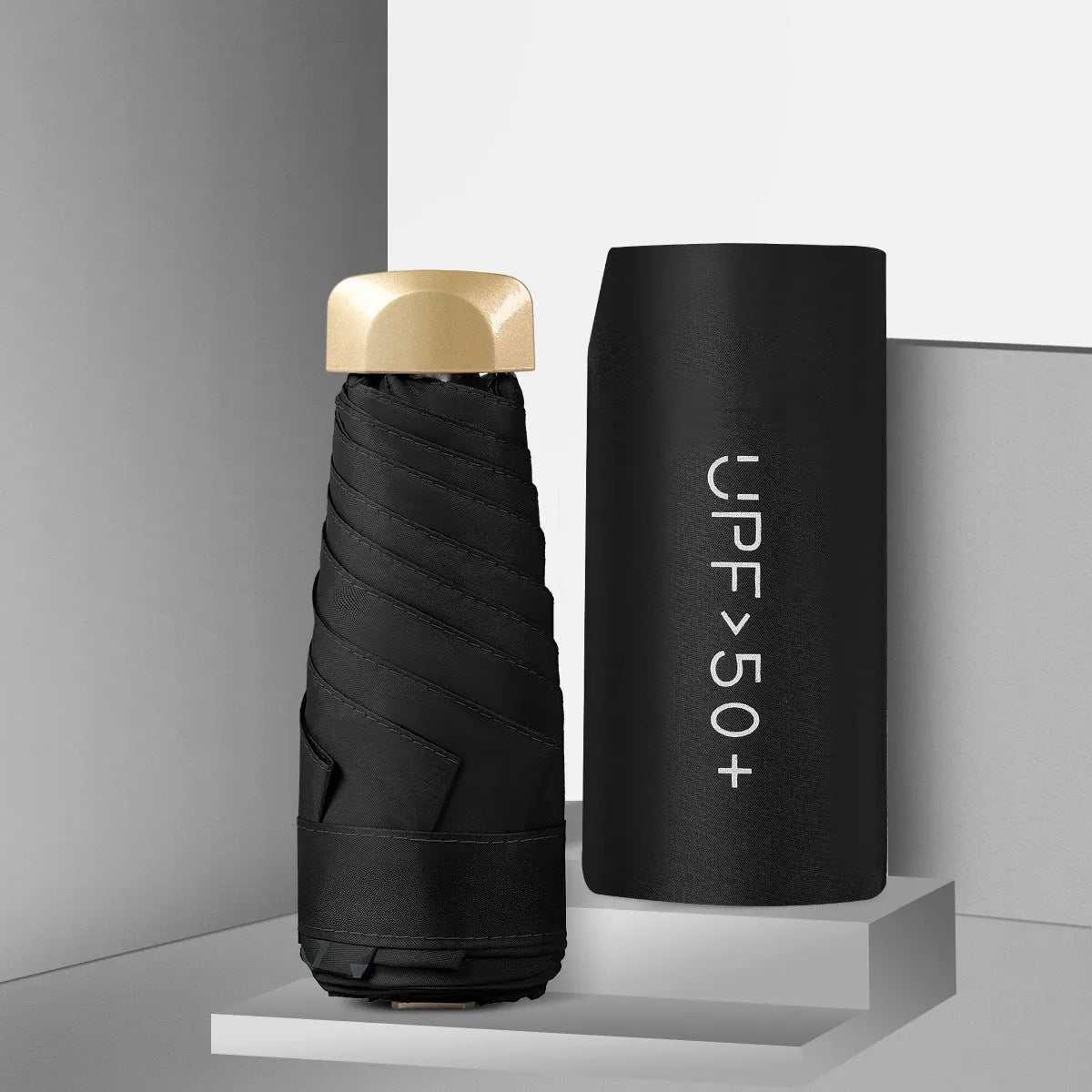 Closed five-fold mini pocket sun umbrella with alloy frame and rubber handle, shown in a selection of available colours.