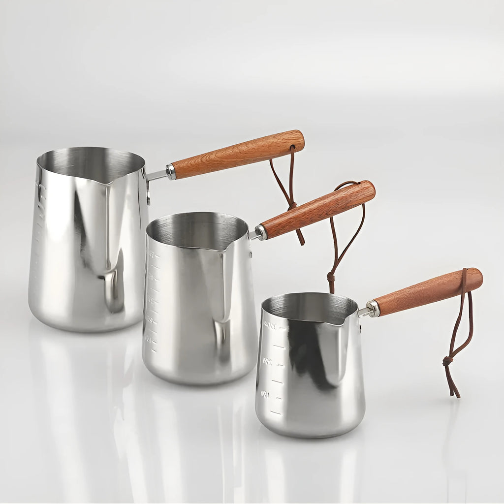 Stainless steel garland coffee cup with a scaled wooden handle shown in a simple, solid colour.