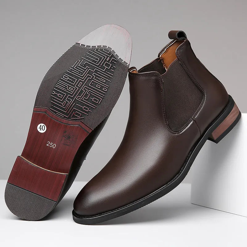 Men's black pointed toe Chelsea boots with a round toe shape and rubber sole.
