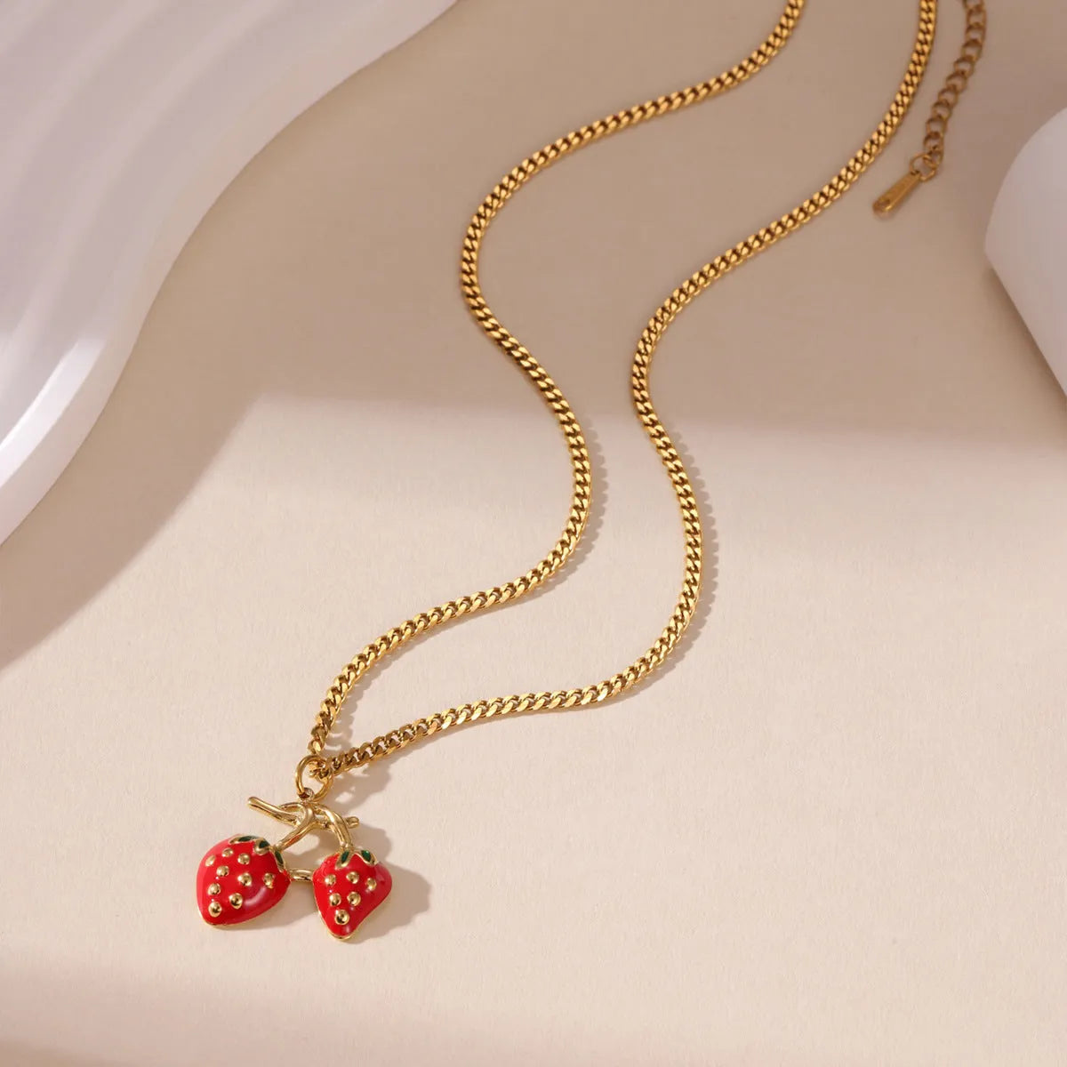 Stainless steel strawberry fruit pendant necklace with white powder gradient finish and red charm
