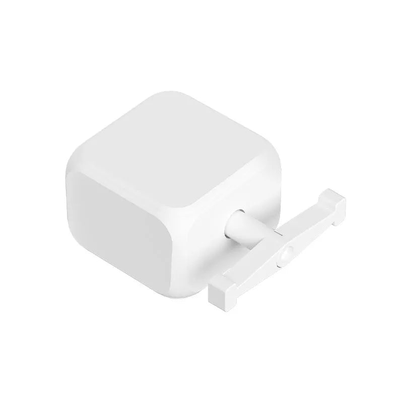 White Bluetooth thumb remote control device measuring 53x29mm