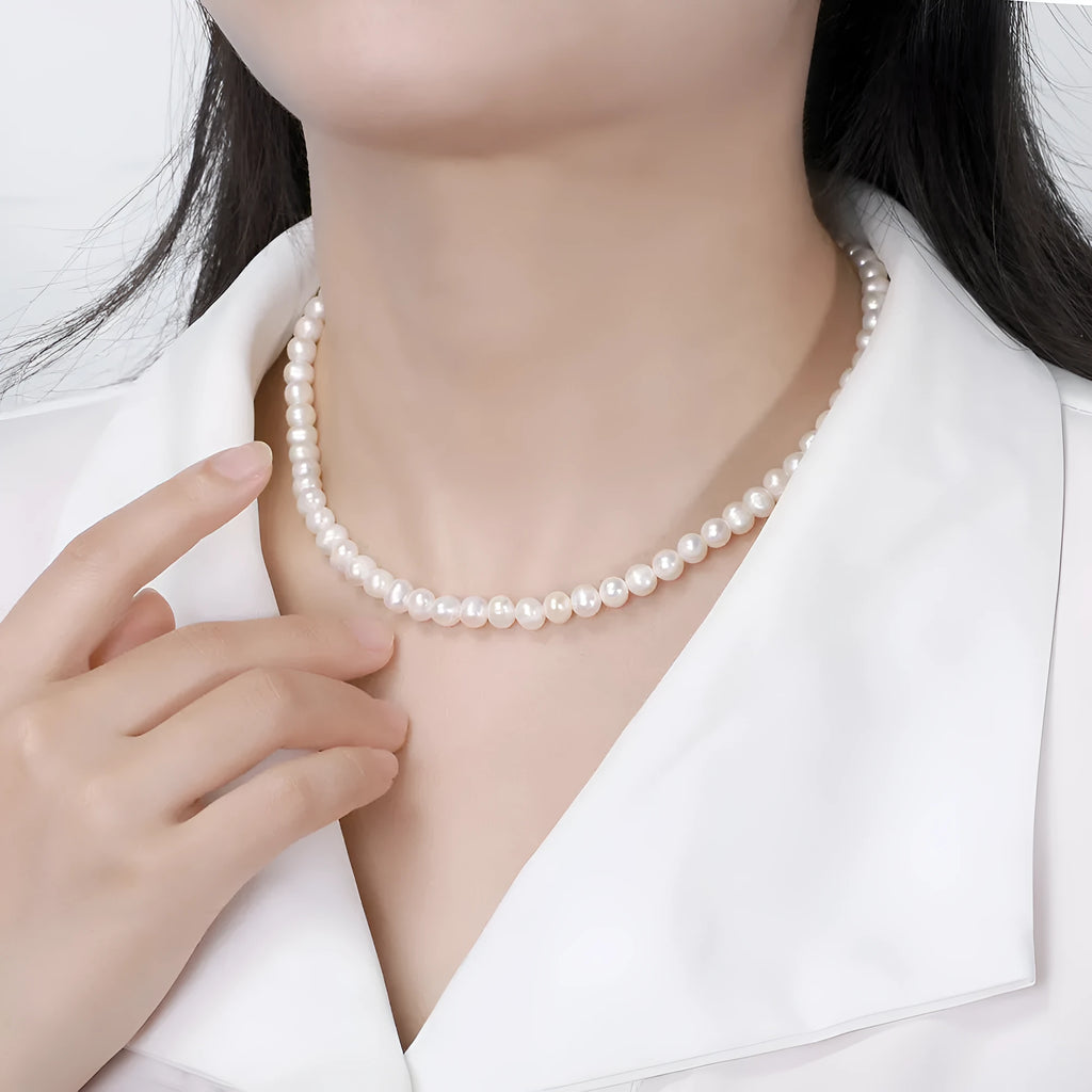 Adjustable sterling silver necklace with natural freshwater pearl pendant