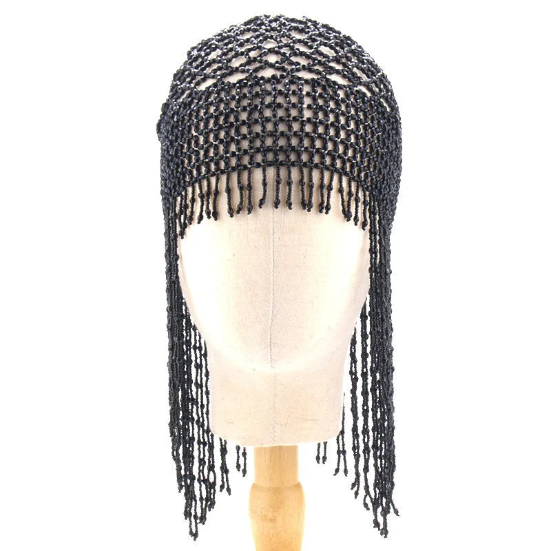 Handmade silver belly dance hat with beaded alloy tile and long black tassels.