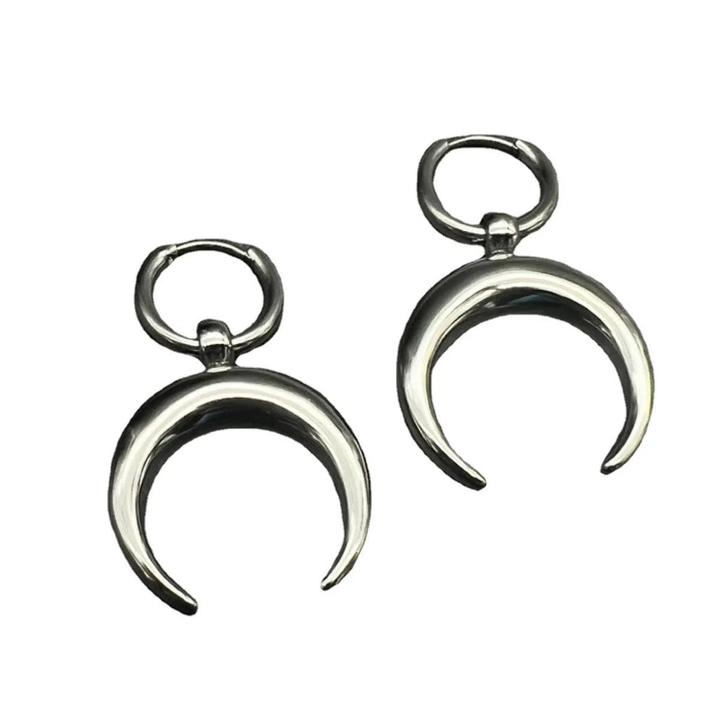 Silver-colour large hoop earrings with moon detailing and geometric shape on ear clip fastening