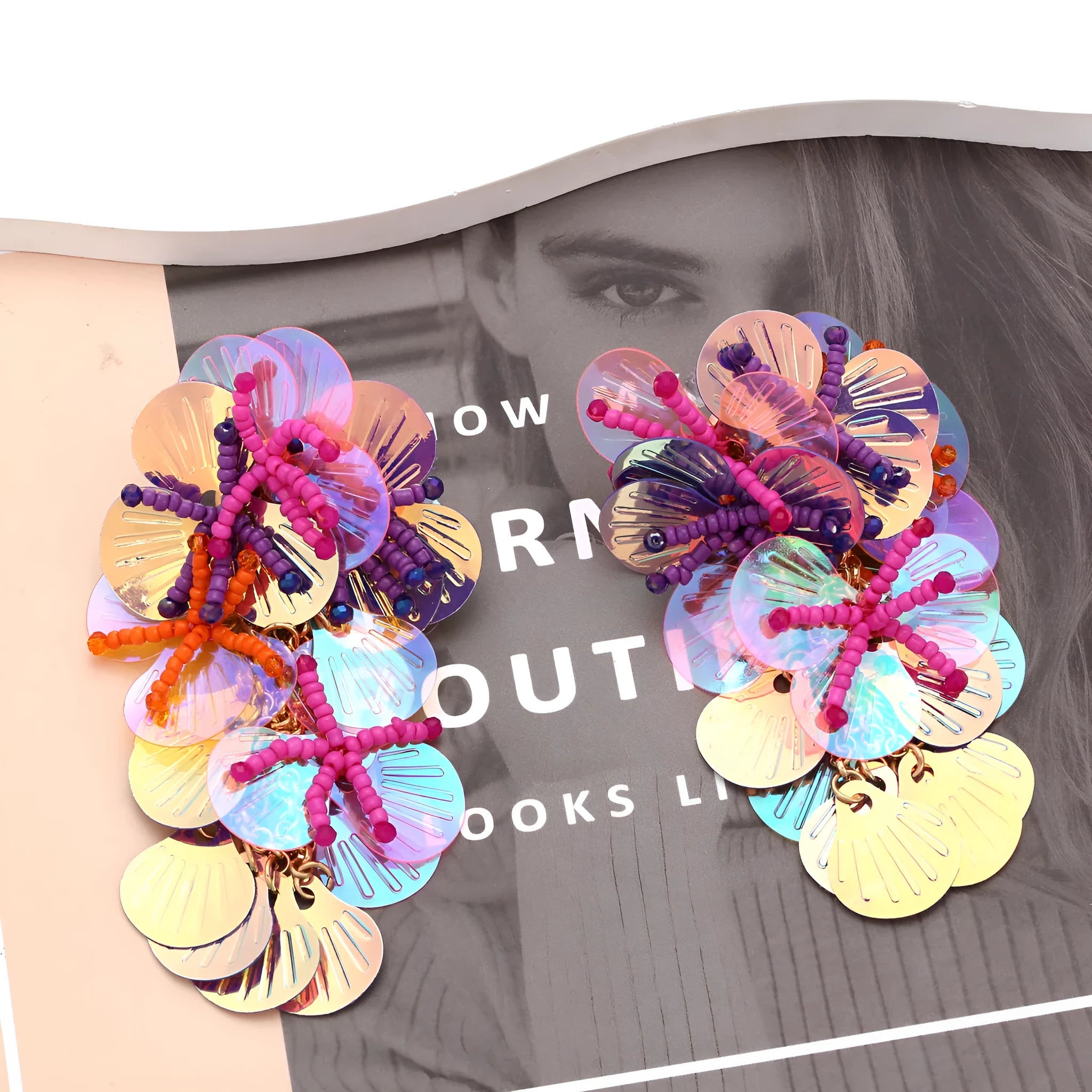 Handmade colourful beaded flower and leaf earrings in exaggerated dopamine style.