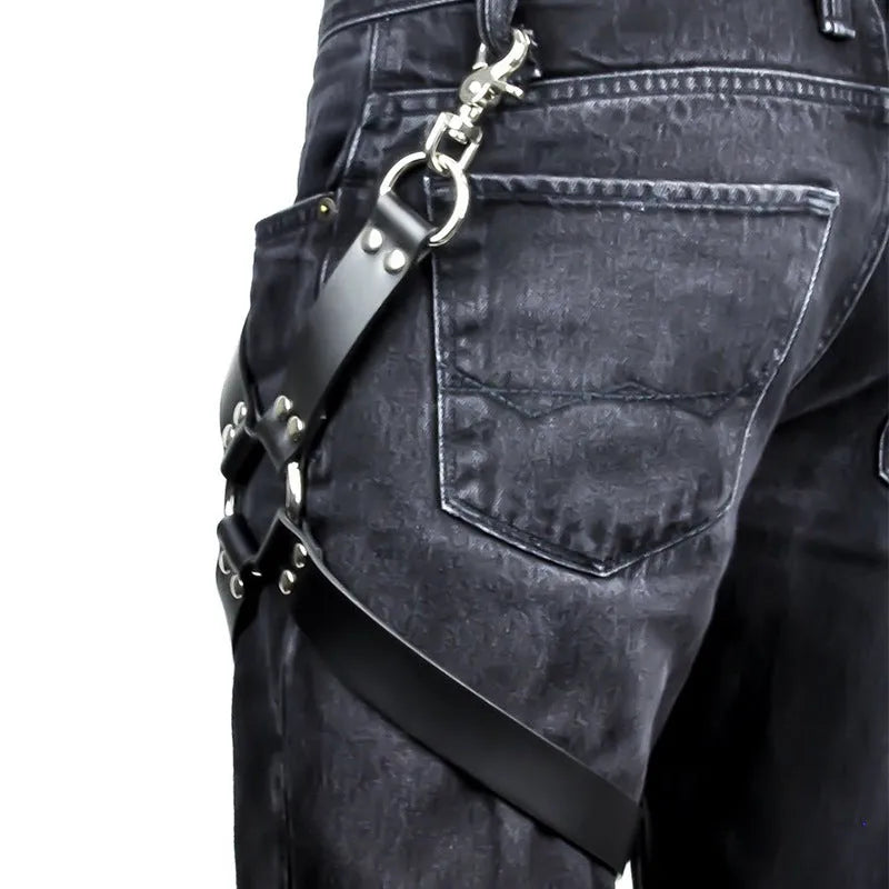 A pair of black PU leather leggings laid flat, showing a smooth, glossy texture.