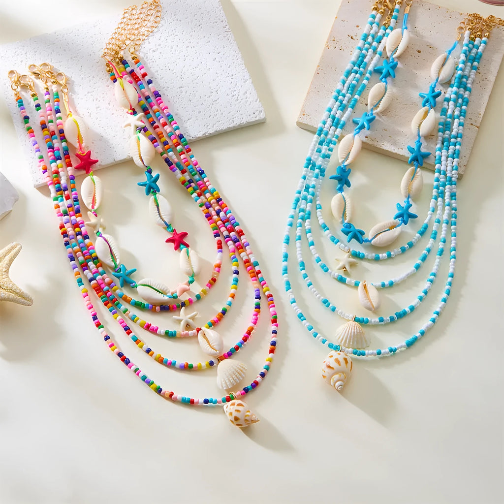 Women's multi-layer necklace set with blue shell pendants and beads, showing five coordinated designs