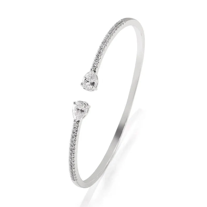 Copper bracelet with zircon inlay in white or blue colour simple design
