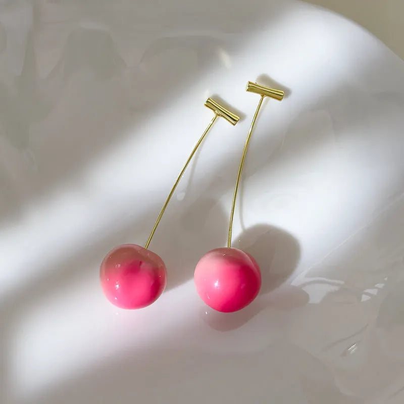 Transparent acrylic peach earrings with copper wires in small and large size options