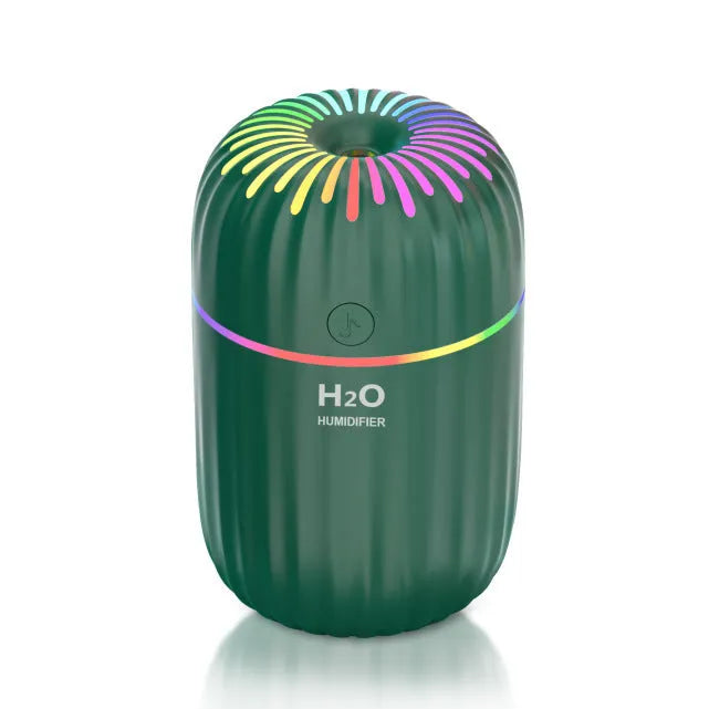 Small green animal-shaped USB humidifier for car and desktop use.