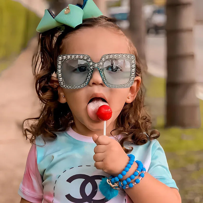 Plastic fashion sunglasses in multiple colour combinations including black frame grey piece and pink mercury options