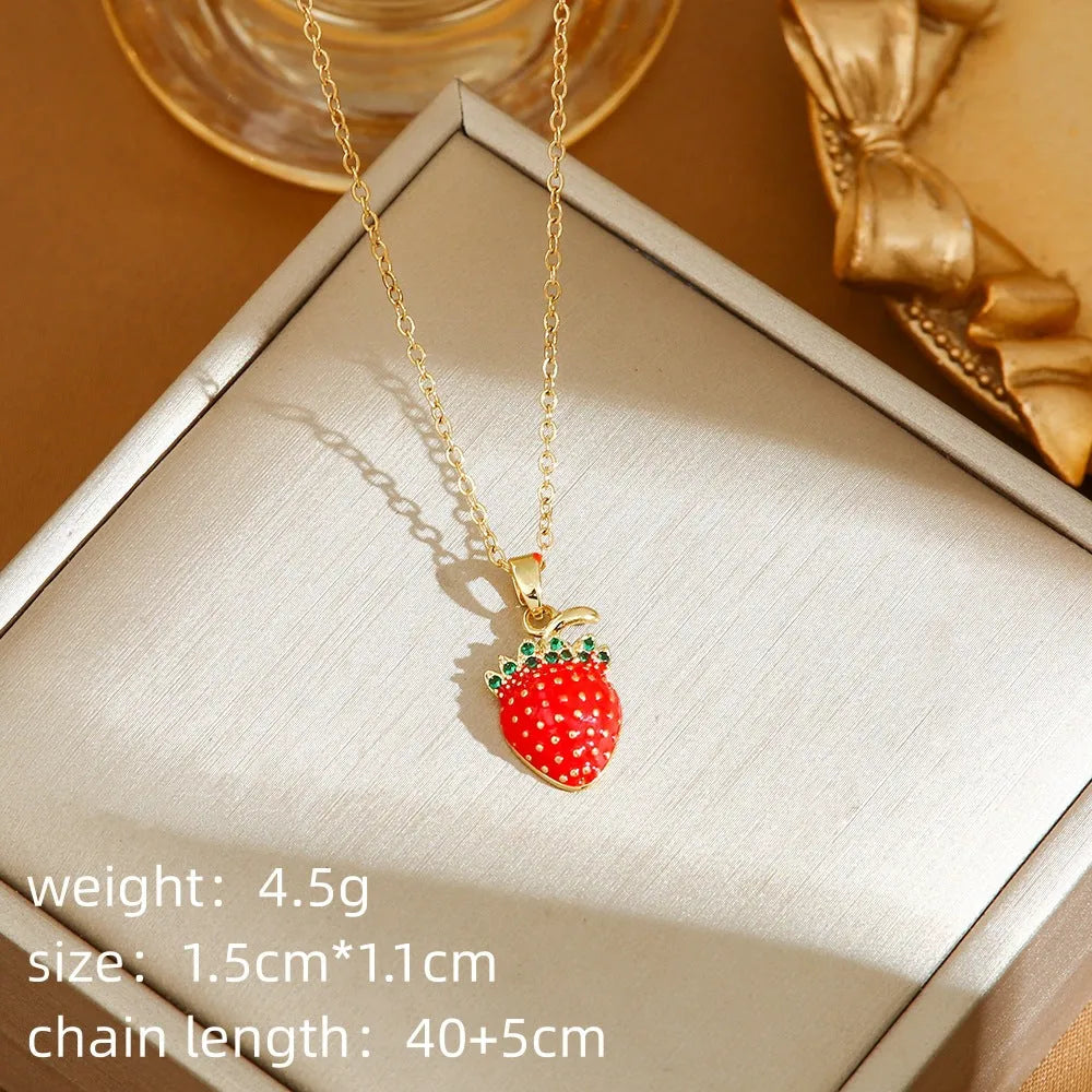 Women's titanium steel necklace with delicate indie pendant designs including strawberry, cherry, and pepper motifs