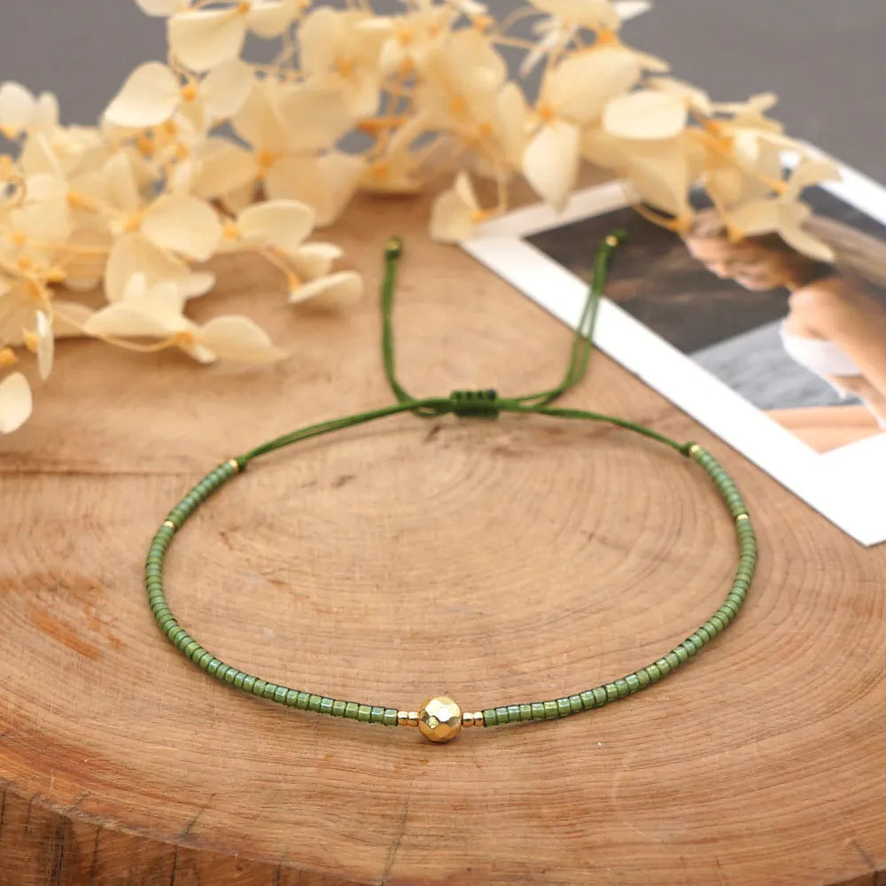 A colourful Bohemian style beaded bracelet with semi-precious stone and glass beads on an adjustable strap.