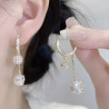 Silver tone clip-on earrings with tassel ball and rhinestone ball pendants in drop design