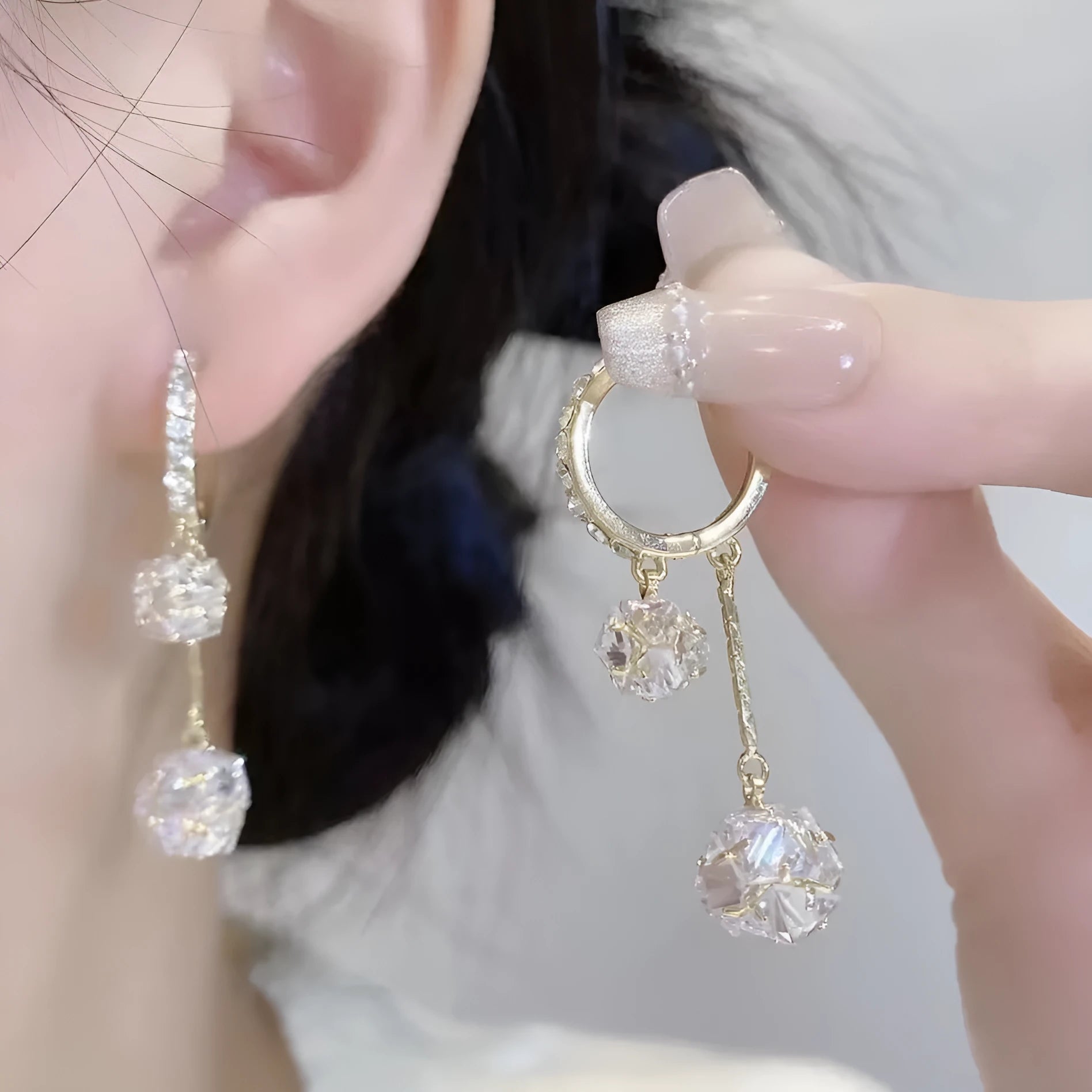 Silver tone clip-on earrings with tassel ball and rhinestone ball pendants in drop design