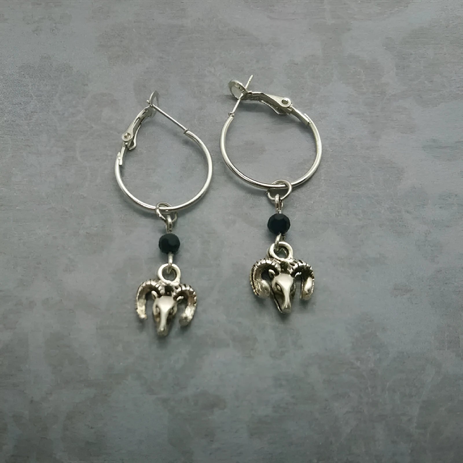 Silver round ring earrings with Tibetan antelope design on circular alloy frames