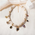 Close-up of a heart-shaped bamboo motif pendant necklace for women on an electroplated chain.