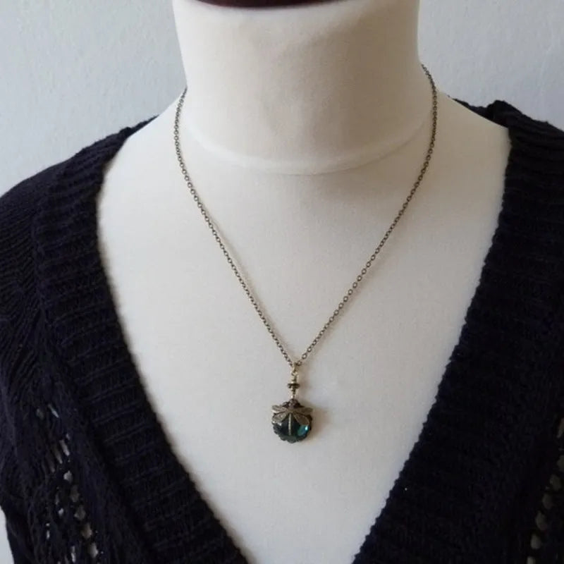 Hand carved dragonfly pendant necklace in vintage bronze finish on sterling silver chain
