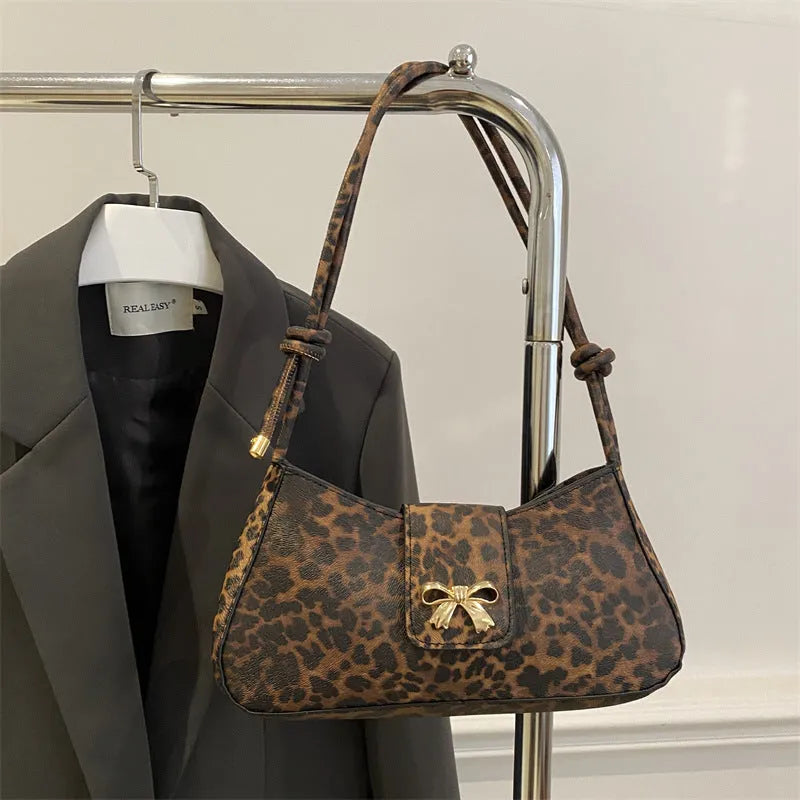 Large casual PU handbag for women in black, shown with sandwich pocket detail.