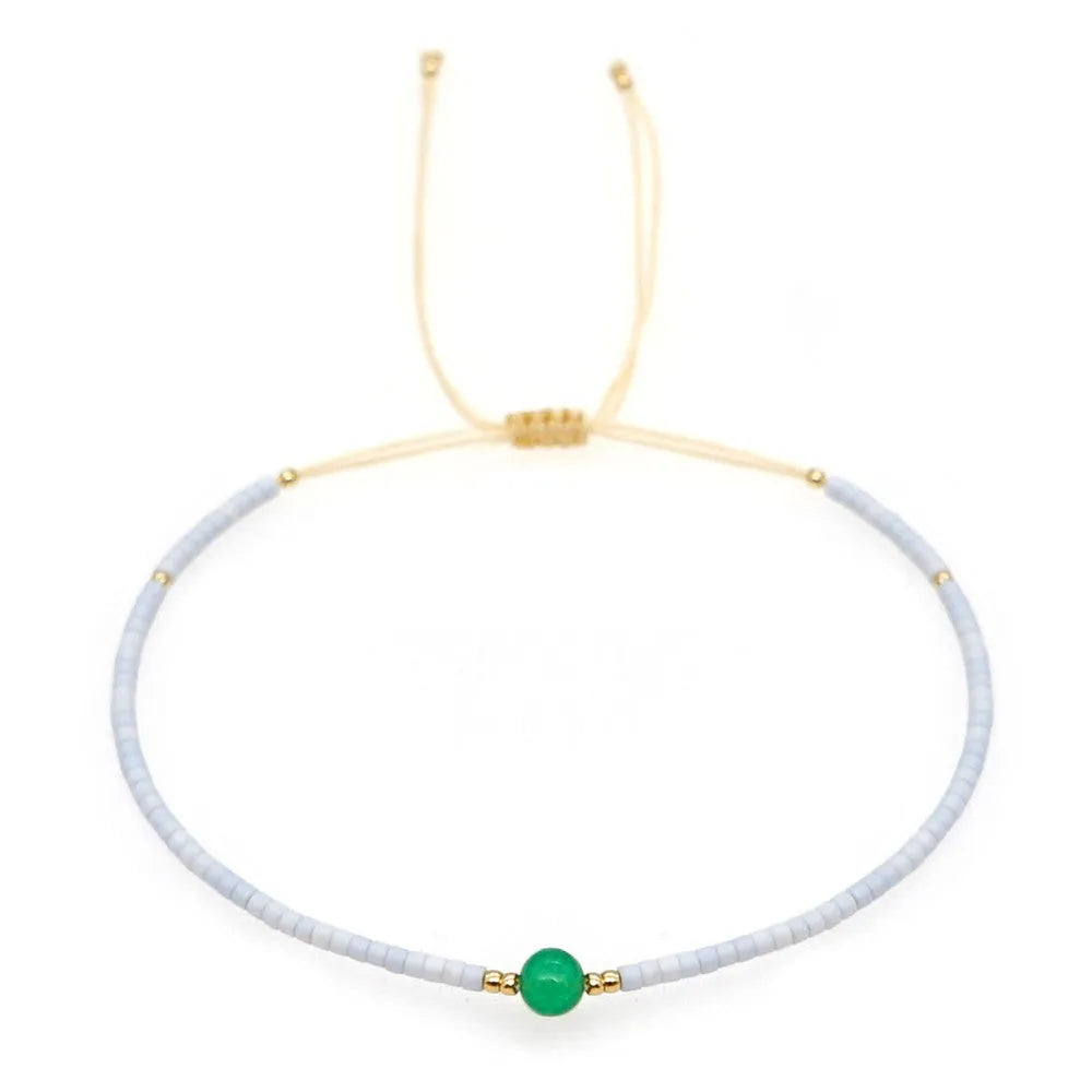 A colourful Bohemian style beaded bracelet with semi-precious stone and glass beads on an adjustable strap.
