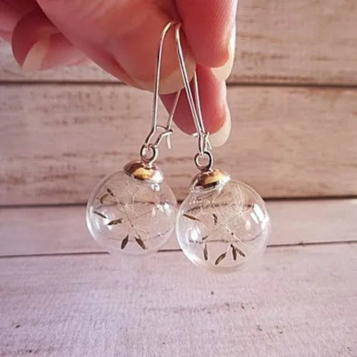 Transparent glass ball earrings with dandelion seed crystal design in silver and bronze finishes