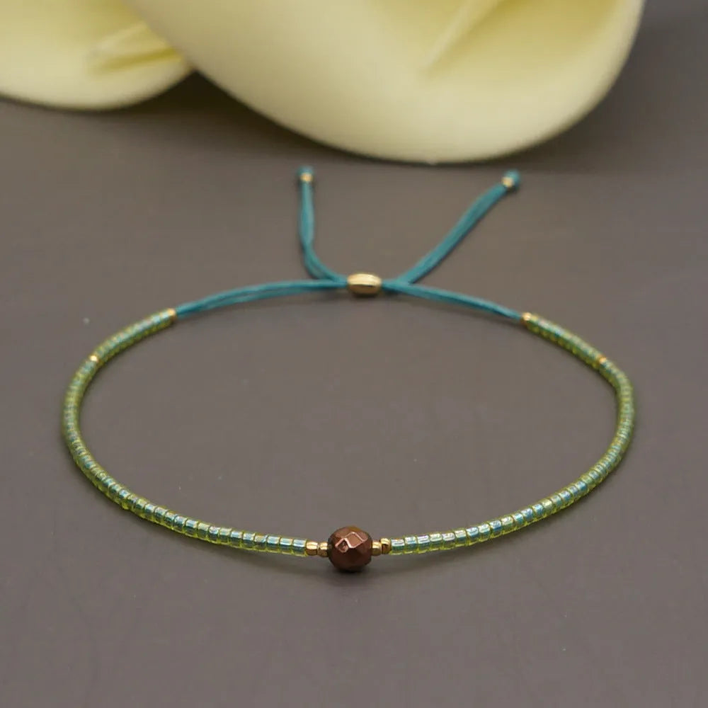 A colourful Bohemian style beaded bracelet with semi-precious stone and glass beads on an adjustable strap.