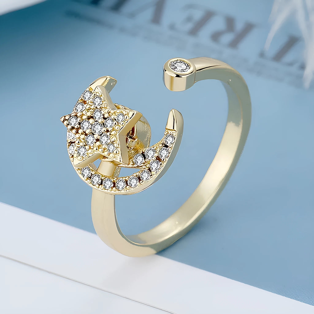 Micro-inlaid free rotating zircon star moon anti-anxiety ring in gold on white background