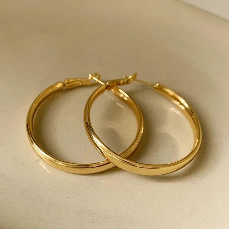 40mm diameter metal circle earrings in gold and silver electroplated finishes