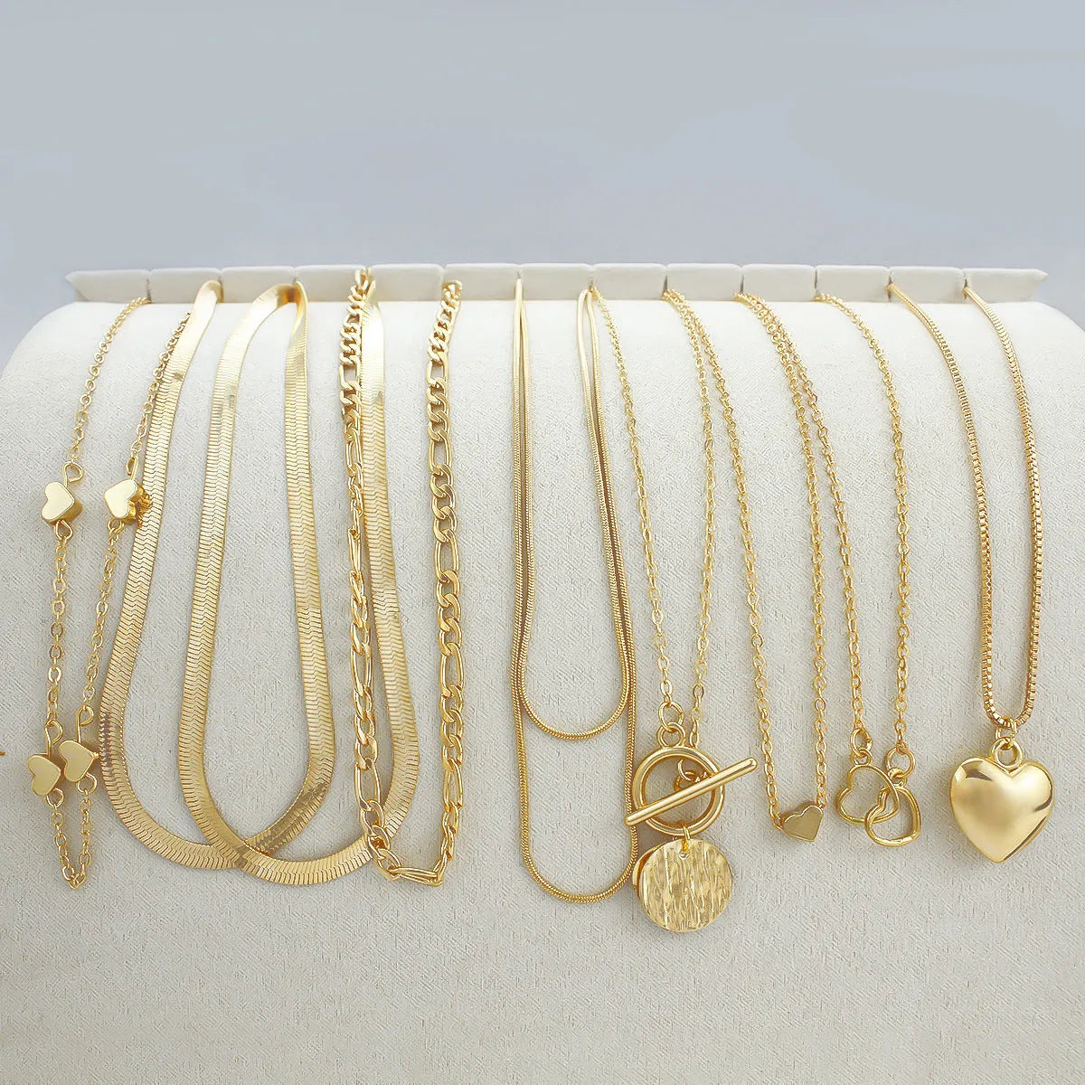 Ten gold electroplated necklaces with alloy pendants on snake bones chains, adjustable 21-50cm length
