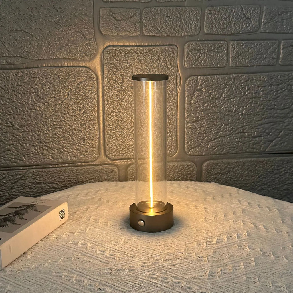 Grey modern LED line glass light strip with magnetic suction base for USB charging.