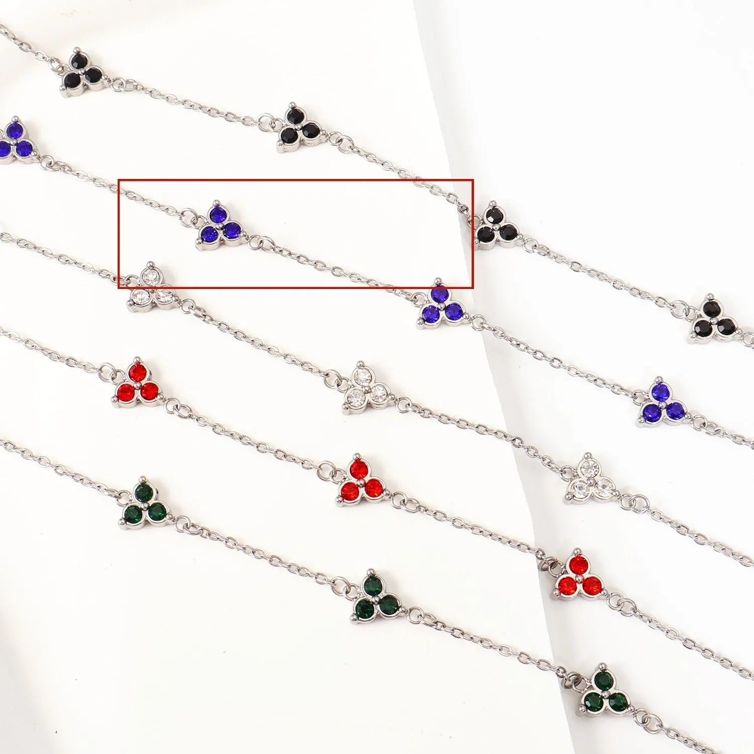 Geometric triangle women's bracelet in stainless steel with a choice of coloured centre stones on a gold or steel band.