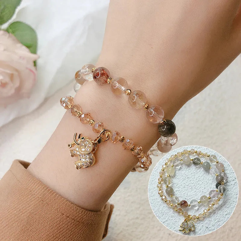 Women's retro bracelet in colour hair crystal or strawberry quartz with ethnic design elements