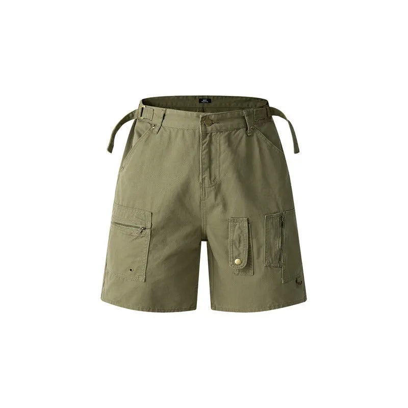 Man wearing grey retro loose-fit washed cotton workwear shorts with a half elastic waistband.