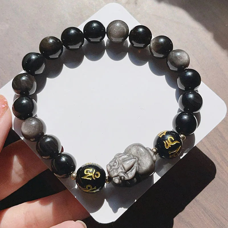 Men's silver stone bracelet with engraved zodiac and proverb designs on beaded surface