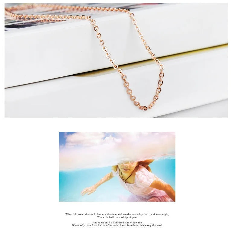 Rose gold electroplated heart-shaped crystal pendant necklace with cross chain design