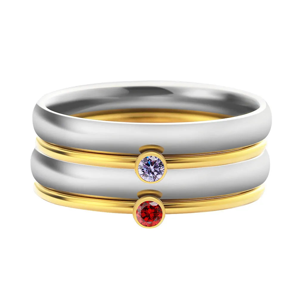 Geometric titanium steel ring featuring an engraved December birthstone design on a finger.