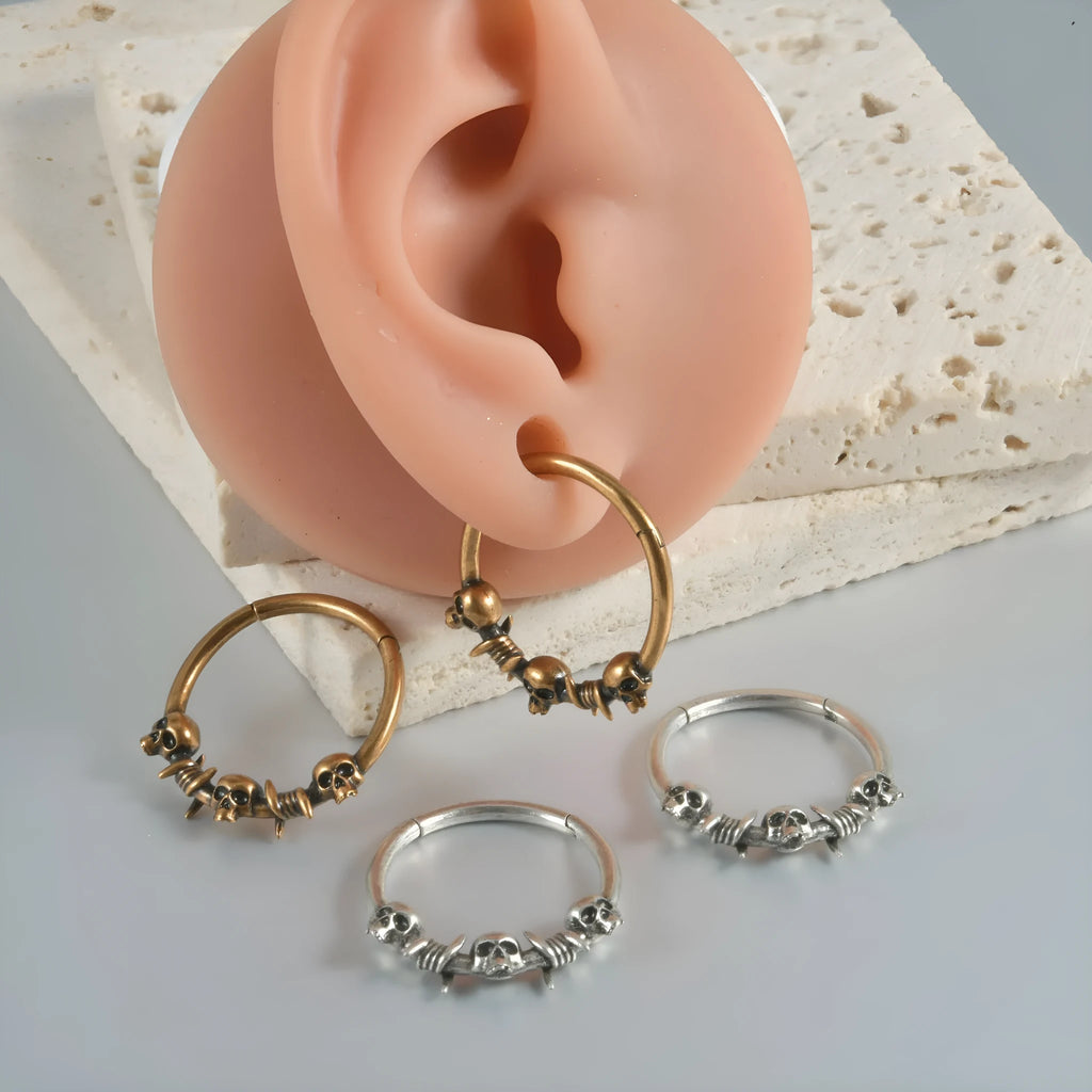 Copper punk earrings with ghost head designs in antique silver or ancient gold finishes
