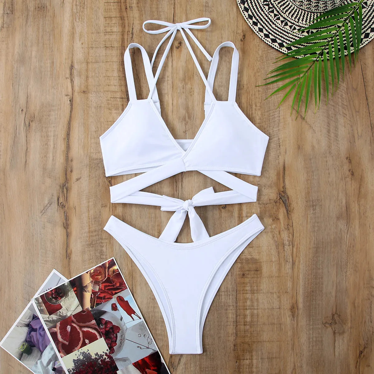 Women's solid colour bikini swimsuit on a hanger, showing adjustable straps and briefs style.