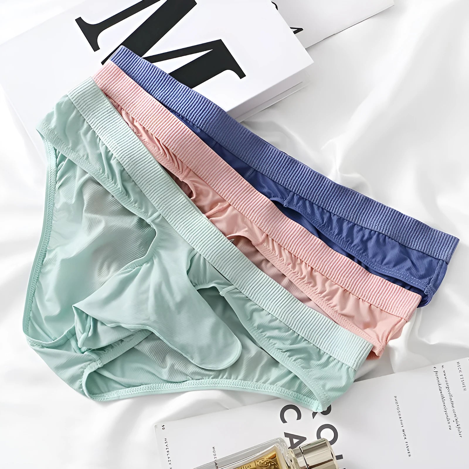 Men's low waist ice silk briefs in five colour options showing knitted nylon fabric
