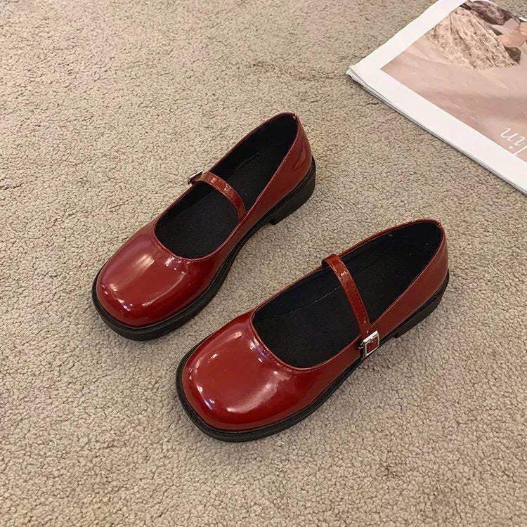Women's red French vintage flat shoes with round toe and solid colour PU upper.