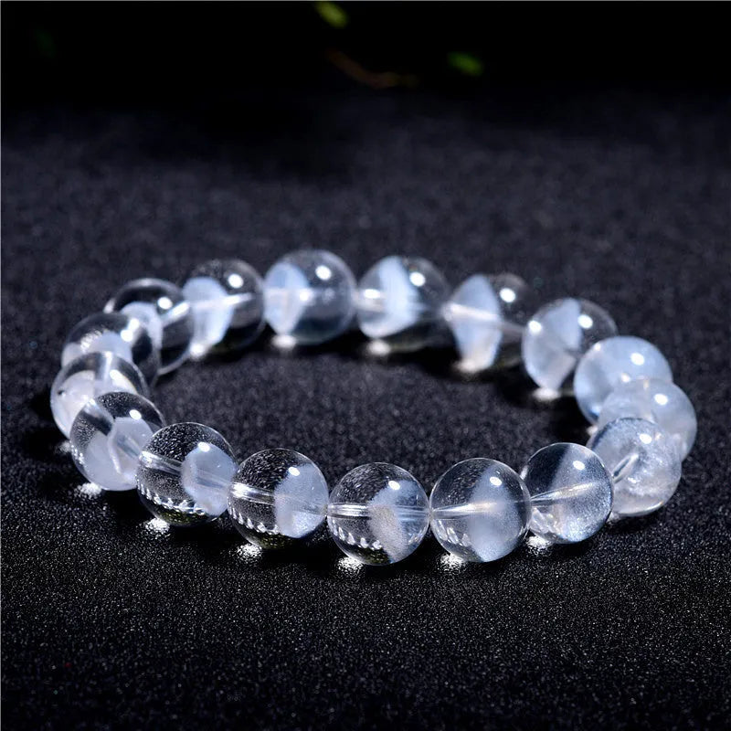 Women's natural white ghost pyramid bracelet with ground crystal beads and Ruyi design element